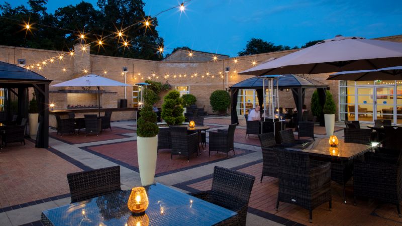 Outdoor courtyard at Eastwood Hall lit up with fairy lights